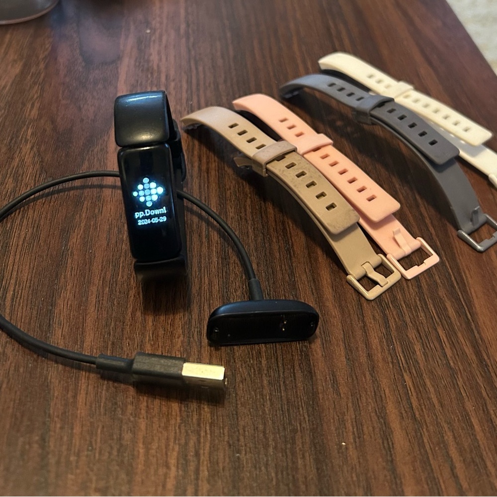 Fitbit Smartwatch with Black, Pink, White, and Gray Bands